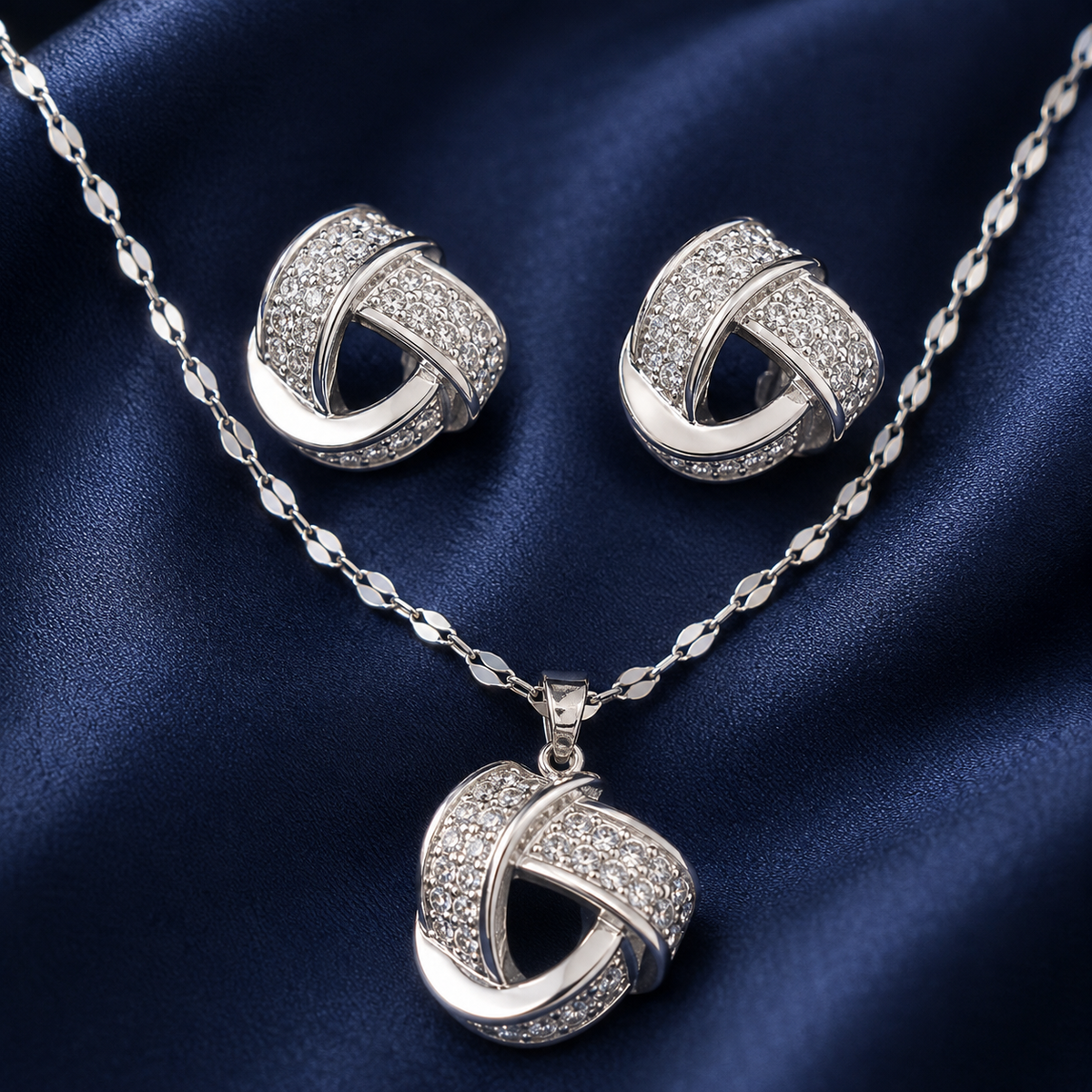 Ensemble collier et boucles nœud serti argenté