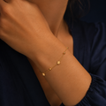 Bracelet étoiles et billes doré