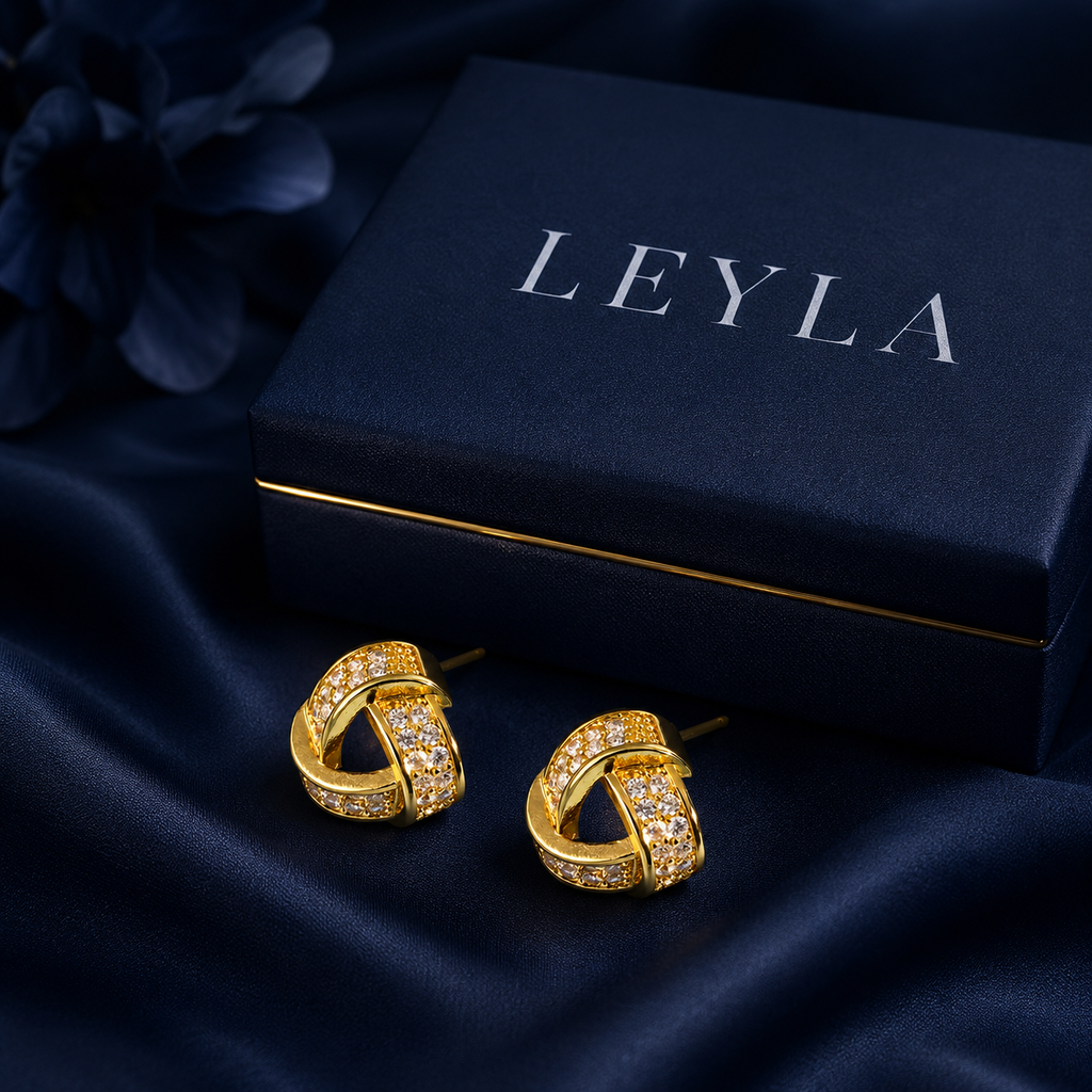 Boucles d'oreilles nœud pavé doré
