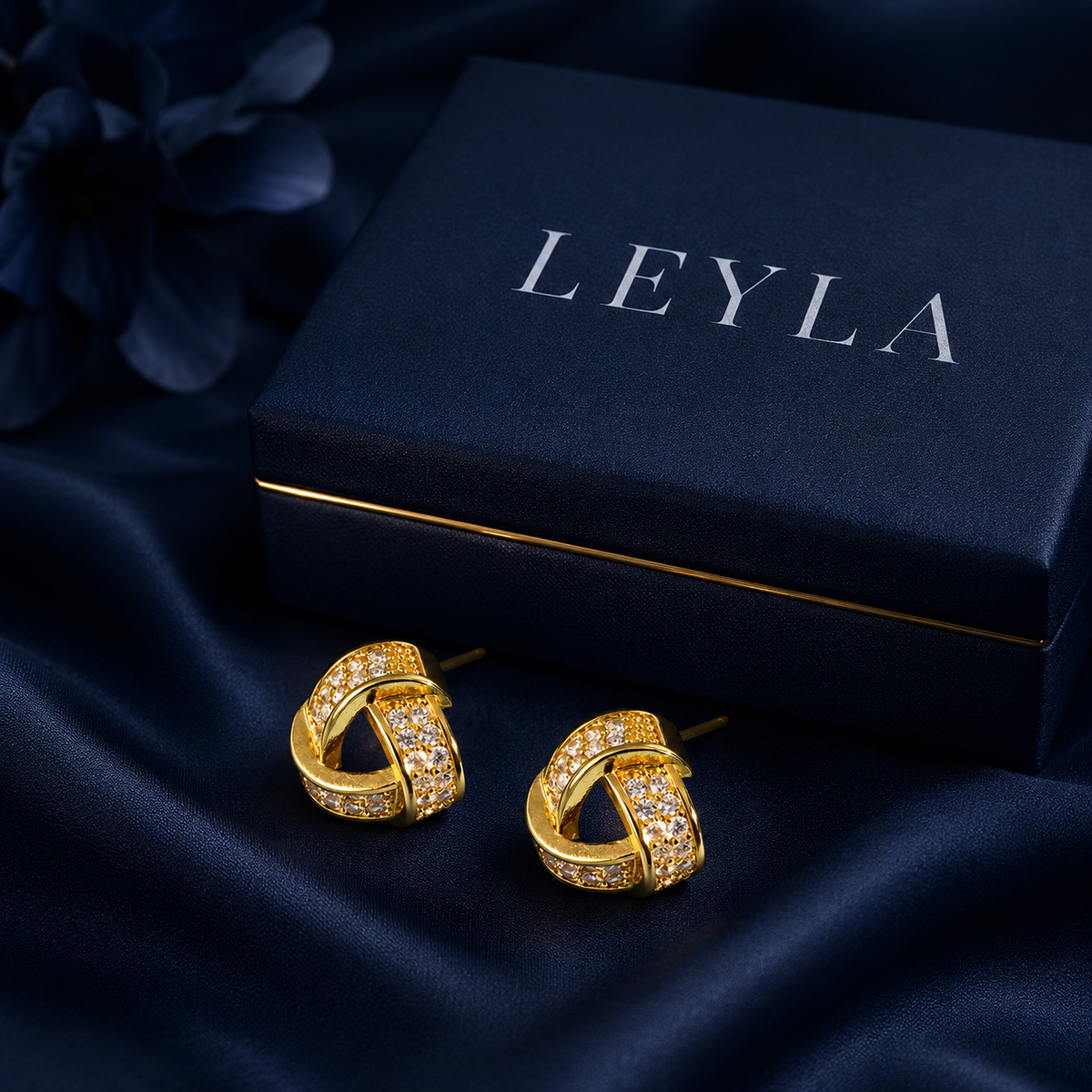 Boucles d'oreilles nœud pavé doré